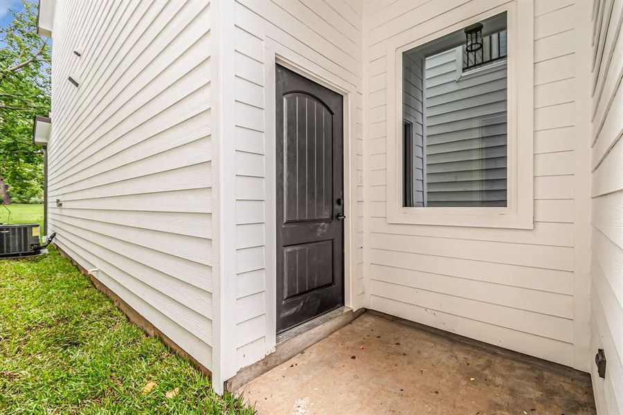 Side entry door with covered porch.