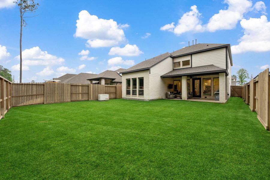 Exterior details and patio area of a home in The Highlands, Porter (Image 22).