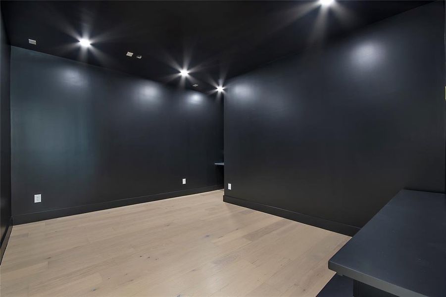 Spare room with light wood-style flooring and baseboards Spare room with light wood-style flooring and baseboards