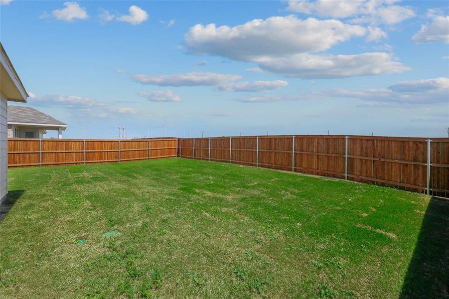 View of yard featuring a fenced backyard View of yard featuring a fenced backyard