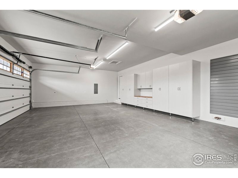 3 Car Garage with Cabinets and Utility Rack 3 Car Garage with Cabinets and Utility Rack