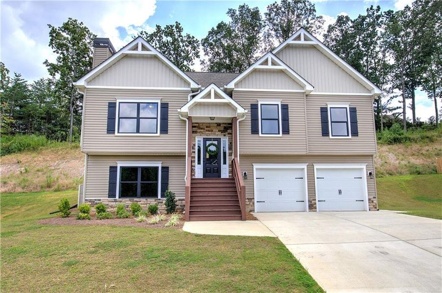 Front exterior of a new home in , Rockmart, GA, highlighting curb appeal (Image 1).