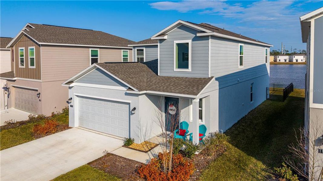 Front exterior of a new home in Preserve at LPGA, Daytona Beach, FL, highlighting curb appeal (Image 20).