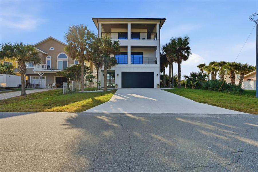 Front exterior of a new home in , Flagler Beach, FL, highlighting curb appeal (Image 22).