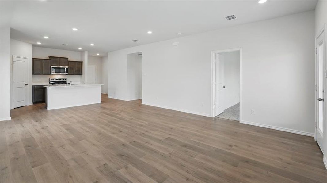 Unfurnished living room featuring recessed lighting and light wood-type flooring