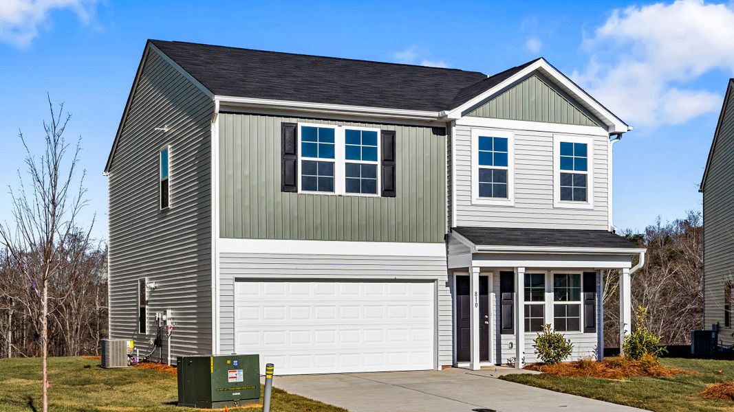 Front exterior of a new home in Bell West, Kernersville, NC, highlighting curb appeal (Image 18). Front exterior of a new home in Bell West, Kernersville, NC, highlighting curb appeal (Image 18).