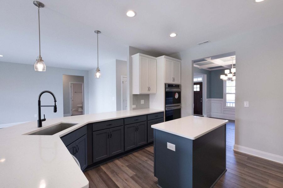 Gourmet kitchen and two-toned cabinets