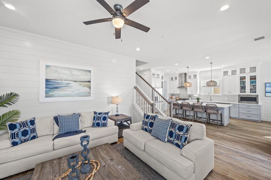 The shiplap wall in the living room creates a perfect backdrop, capturing the essence of coastal living.