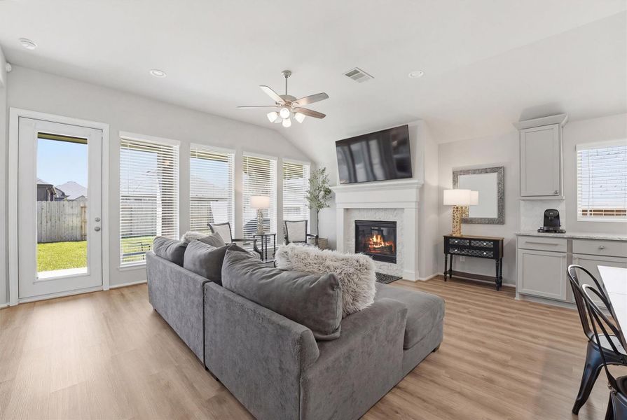 Family room with plenty of natural light and fireplace