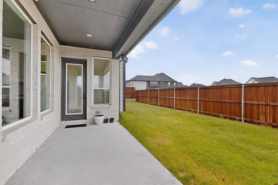 Exterior details and patio area of a home in The Homestead - 62', Rockwall (Image 25). Exterior details and patio area of a home in The Homestead - 62', Rockwall (Image 25).