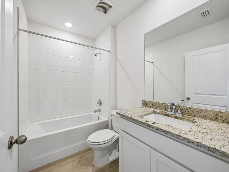 Furnished interior view inside a new home in The Reserve at Van Oaks, Auburndale (Image 8).