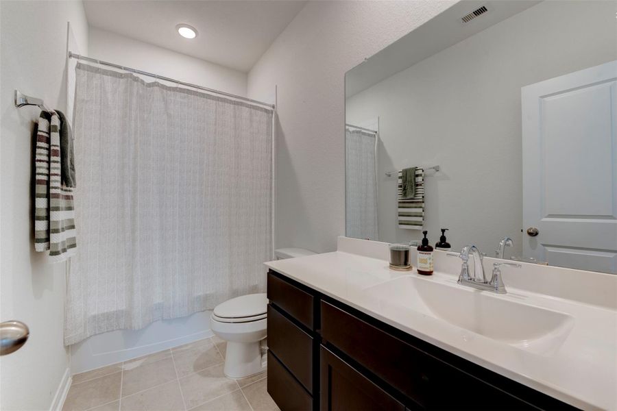 Furnished interior view inside a new home in Sunterra, Katy (Image 5).