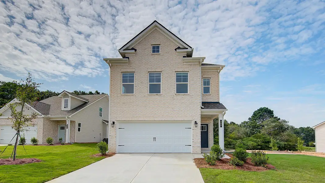 Representative exterior photo of a completed home built from the Kelsey by DRB Homes in Abbotts Crossing, Conyers, GA (Image 1).