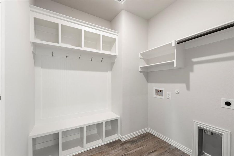 Laundry area with dark wood-style floors, washer hookup, gas dryer hookup, and electric dryer hookup