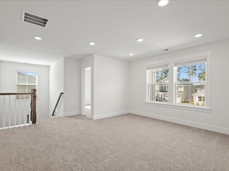 Spacious, unfurnished interior of a new home in The Coves at Lakes of Cane Bay, Summerville (Image 22). Spacious, unfurnished interior of a new home in The Coves at Lakes of Cane Bay, Summerville (Image 22).