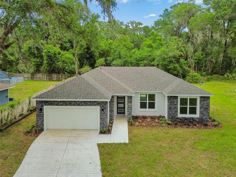Front exterior of a new home in , Deland, FL, highlighting curb appeal (Image 25).