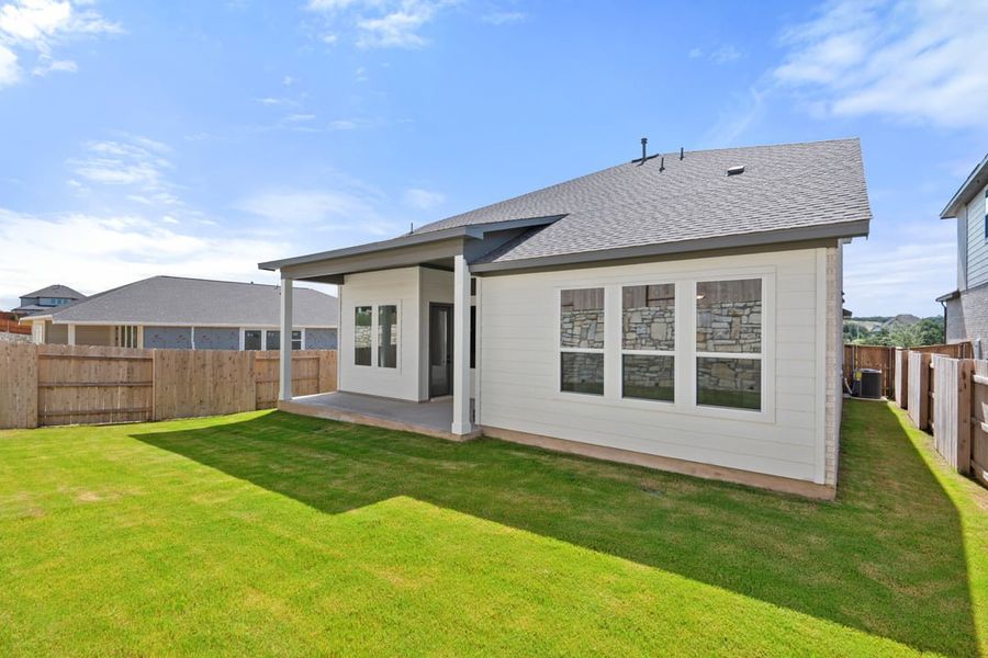 Front exterior of a new home in Park Collection at Lariat, Liberty Hill, TX, highlighting curb appeal (Image 27). Front exterior of a new home in Park Collection at Lariat, Liberty Hill, TX, highlighting curb appeal (Image 27).