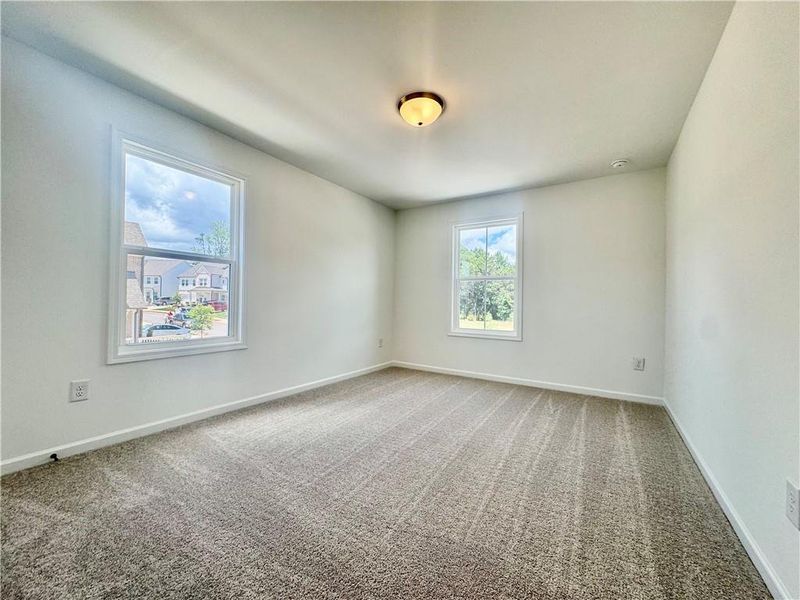 Spacious, unfurnished interior of a new home in Eastlyn Crossing, Flowery Branch (Image 24).