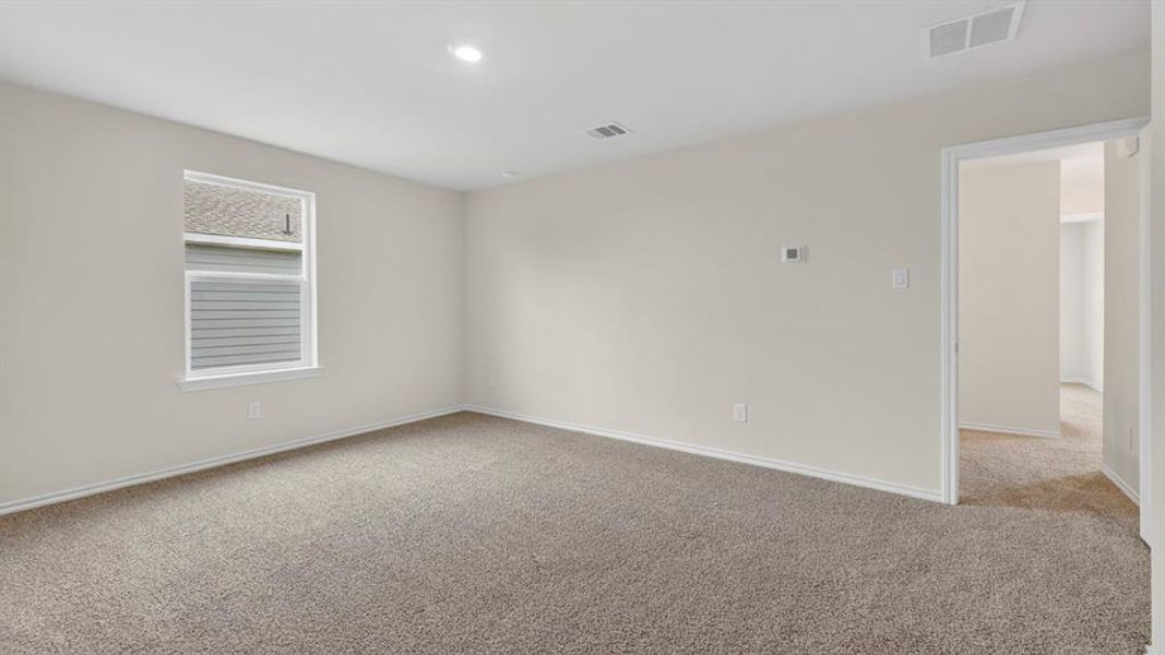 Carpeted room featuring a single window, recessed lighting, base molding, and a neutral wall color