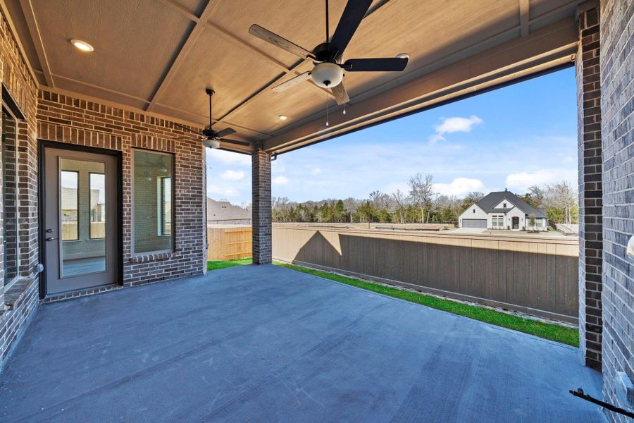 Exterior details and patio area of a home in Chambers Creek, Willis (Image 3).