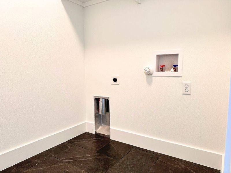 Ready for appliances, this utility space offers essential hookups and a durable flooring choice. Ready for appliances, this utility space offers essential hookups and a durable flooring choice.