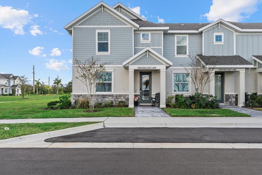Front exterior of a new home in , Sarasota, FL, highlighting curb appeal (Image 22).