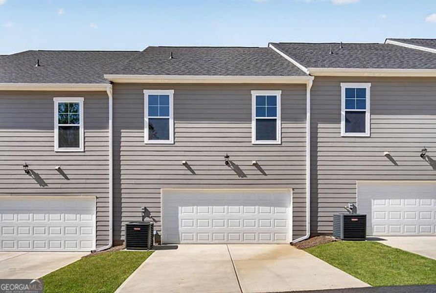 Front exterior of a new home in The Park at Gainesville Township, Gainesville, GA, highlighting curb appeal (Image 15).