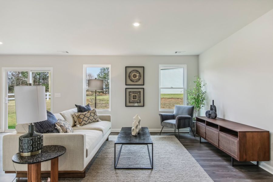 A living room with a couch and a table.