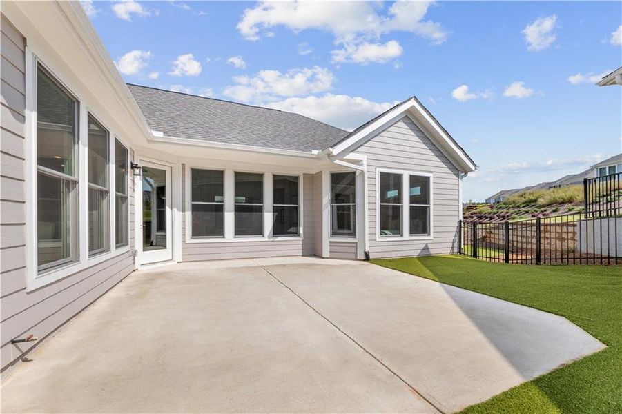 Exterior details and patio area of a home in The Courtyards at Bailey Farms, Dacula (Image 24).