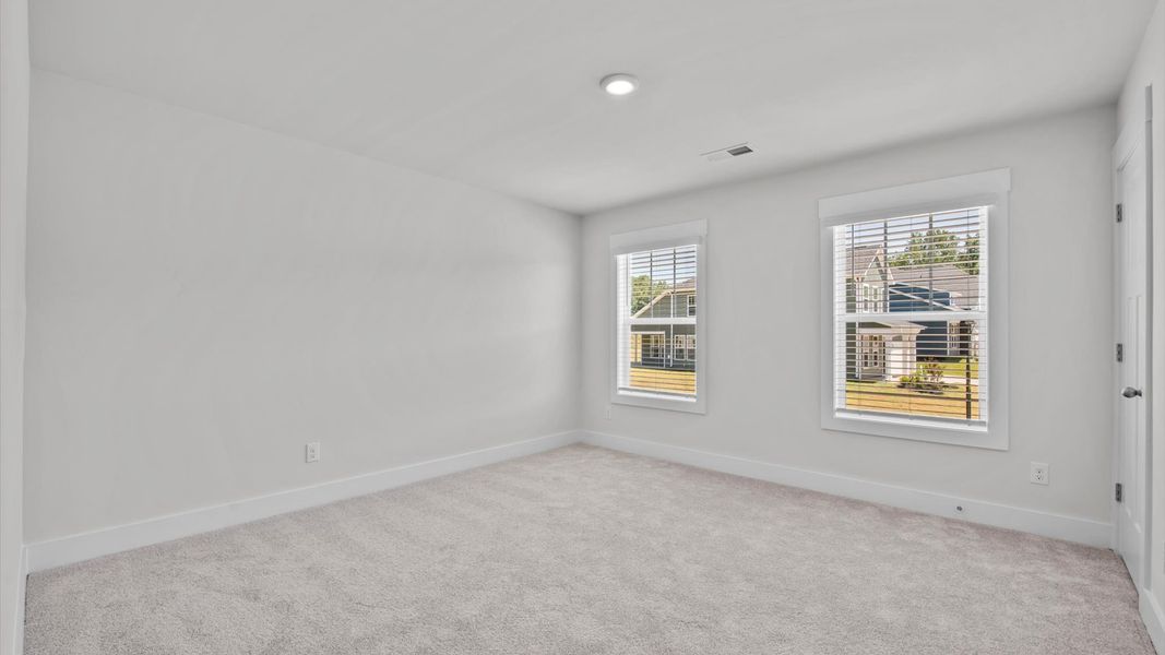 Representative furnished interior of a home built from the Jasmine by DRB Homes in Harrier Point, Woodruff (Image 16).
