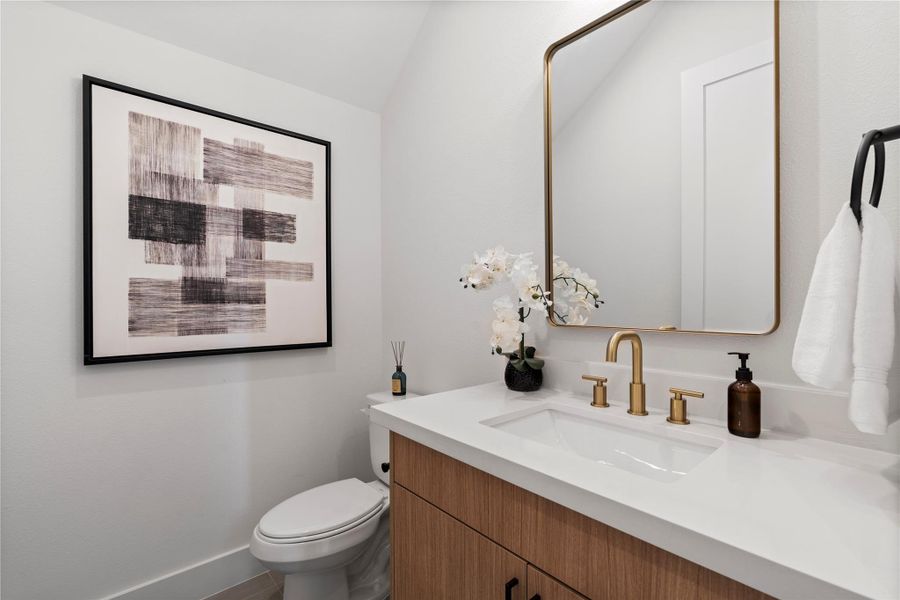 A thoughtfully placed powder bath on the first floor adds both convenience and privacy for guests — making entertaining feel effortless and your home feel even more functional.