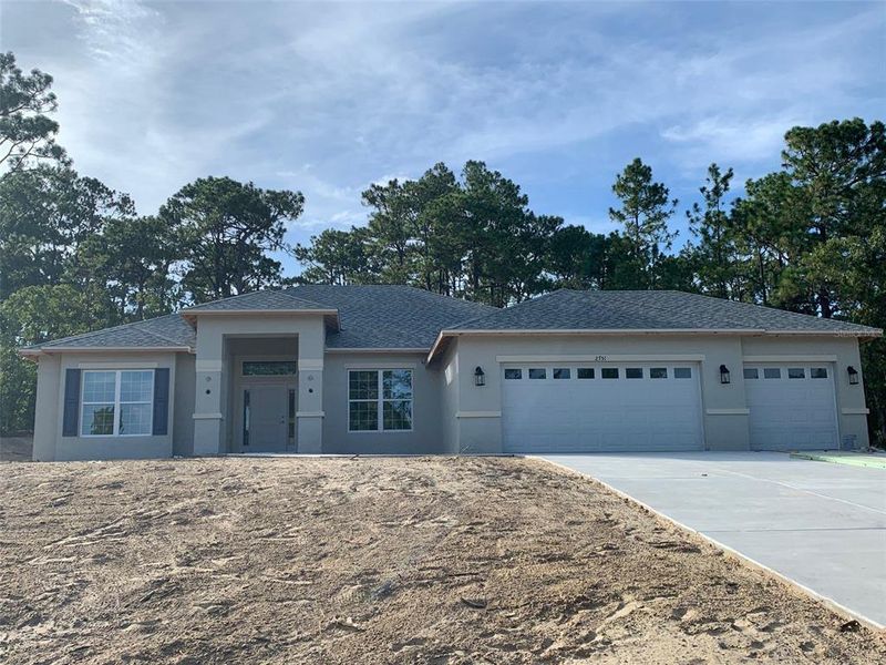 Front exterior of a new home in Pine Ridge, Beverly Hills, FL, highlighting curb appeal (Image 11). Front exterior of a new home in Pine Ridge, Beverly Hills, FL, highlighting curb appeal (Image 11).