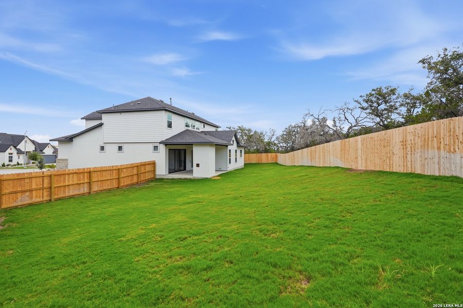 Exterior details and patio area of a home in The Reserve at Potranco Oaks, Castroville (Image 3).