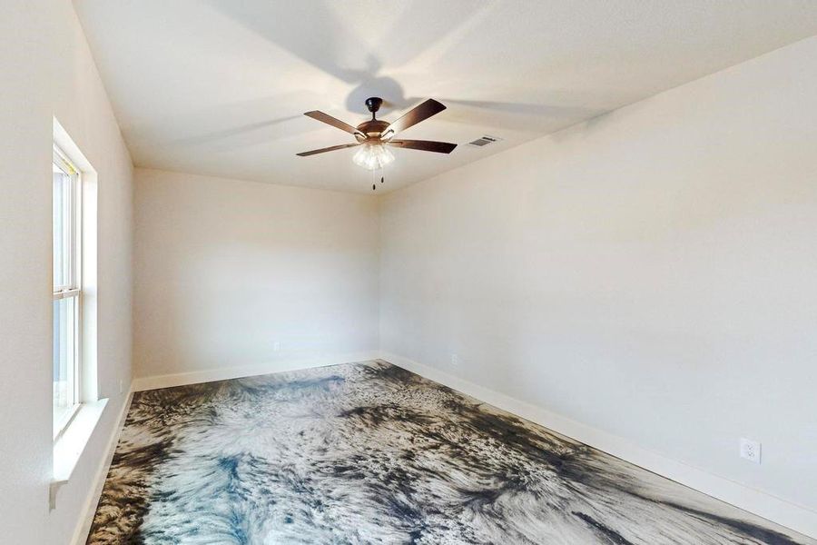 Unfurnished room with ceiling fan