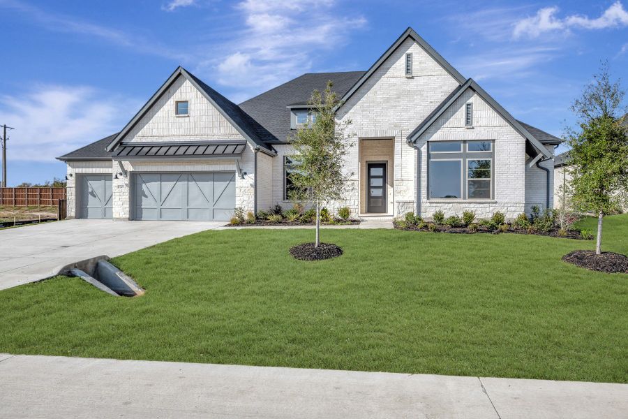 Front exterior of a new home in Northshore at Lakewood Village - Garden Series, Lakewood Village, TX, highlighting curb appeal (Image 1). Front exterior of a new home in Northshore at Lakewood Village - Garden Series, Lakewood Village, TX, highlighting curb appeal (Image 1).