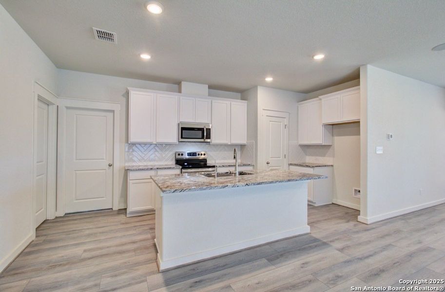 Furnished interior view inside a new home in Prairie Green, Converse (Image 7). Furnished interior view inside a new home in Prairie Green, Converse (Image 7).