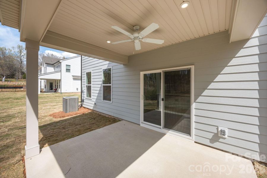 Exterior details and patio area of a home in Farms at Bellingham, Mooresville (Image 20).