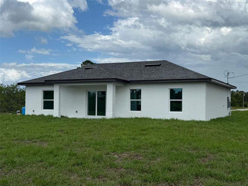 Front exterior of a new home in , Lehigh Acres, FL, highlighting curb appeal (Image 17).