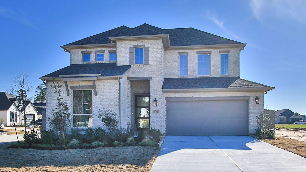 Front exterior of a new home in Artavia, Conroe, TX, highlighting curb appeal (Image 2).