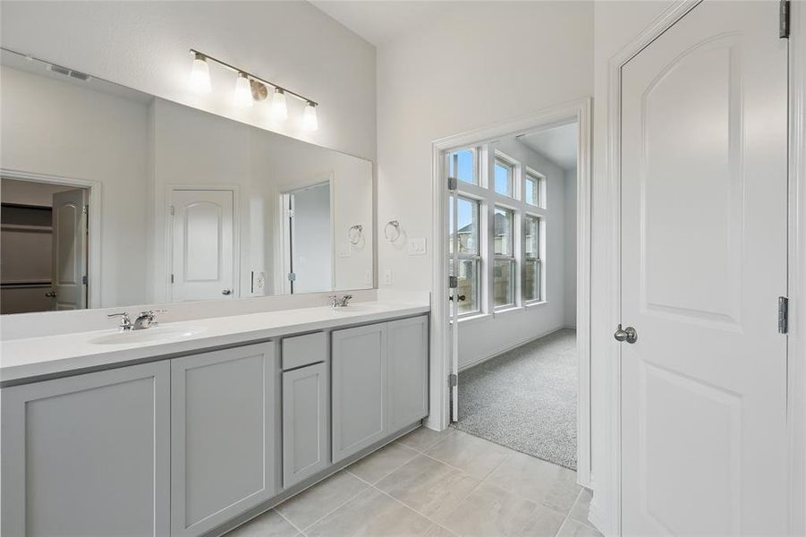 Bathroom with double vanity and tile patterned floors Bathroom with double vanity and tile patterned floors