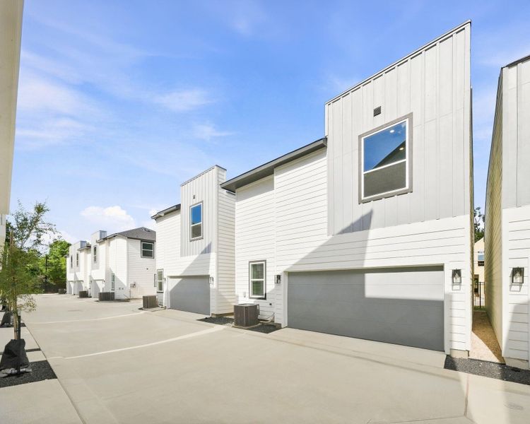 Another view of the private community drive and rear-entry garages, showcasing the clean, thoughtfully designed layout of Highland Heights Crossing. Another view of the private community drive and rear-entry garages, showcasing the clean, thoughtfully designed layout of Highland Heights Crossing.