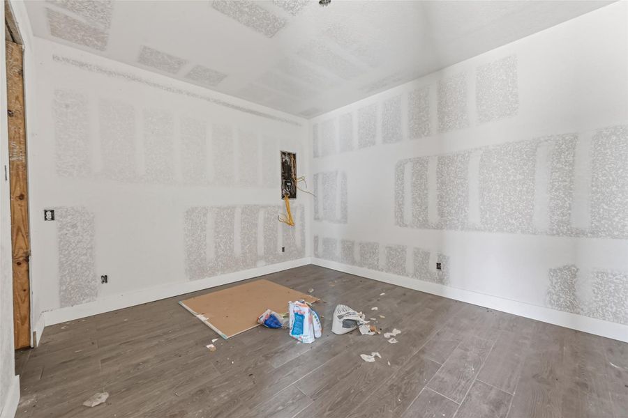 Main-level unfinished interior featuring exposed drywall and construction in progress.