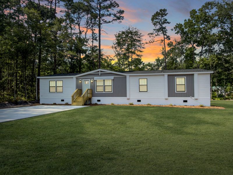 Front exterior of a new home in , Ravenel, SC, highlighting curb appeal (Image 1). Front exterior of a new home in , Ravenel, SC, highlighting curb appeal (Image 1).