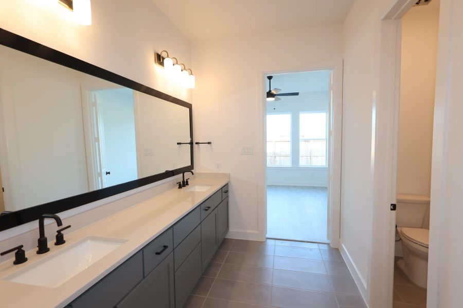 Furnished interior view inside a new home in Grand Central Park 55' Homesites, Conroe (Image 6).