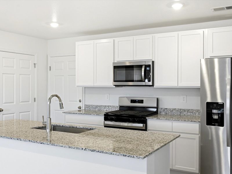 Furnished interior view inside a new home in Skyview at High Point, Aurora (Image 3).