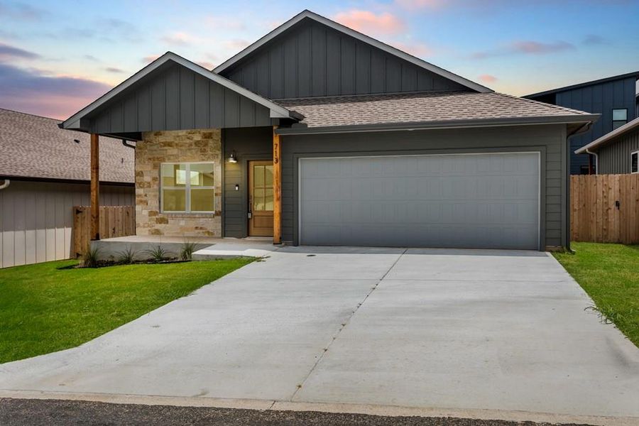 Front exterior of a new home in , Fredericksburg, TX, highlighting curb appeal (Image 1).