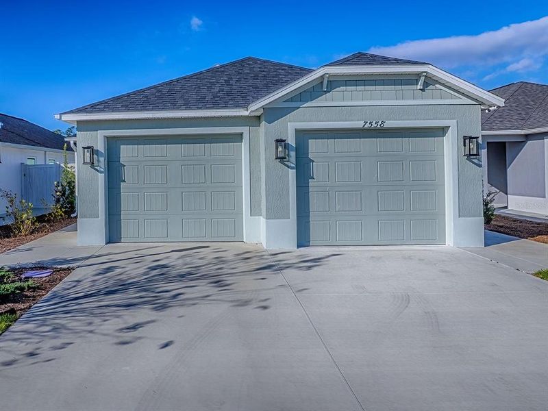 Front exterior of a new home in , The Villages, FL, highlighting curb appeal (Image 28).