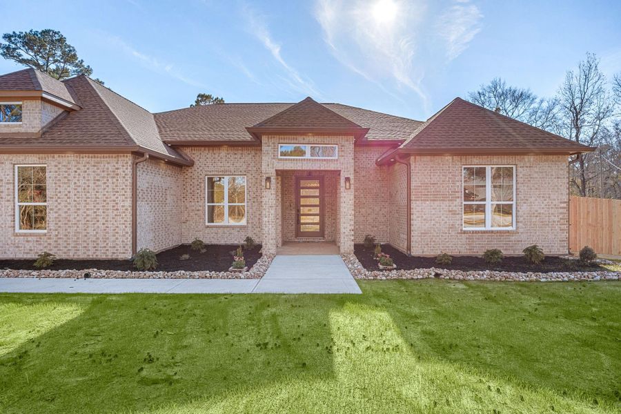 Front exterior of a new home in , Magnolia, TX, highlighting curb appeal (Image 2). Front exterior of a new home in , Magnolia, TX, highlighting curb appeal (Image 2).