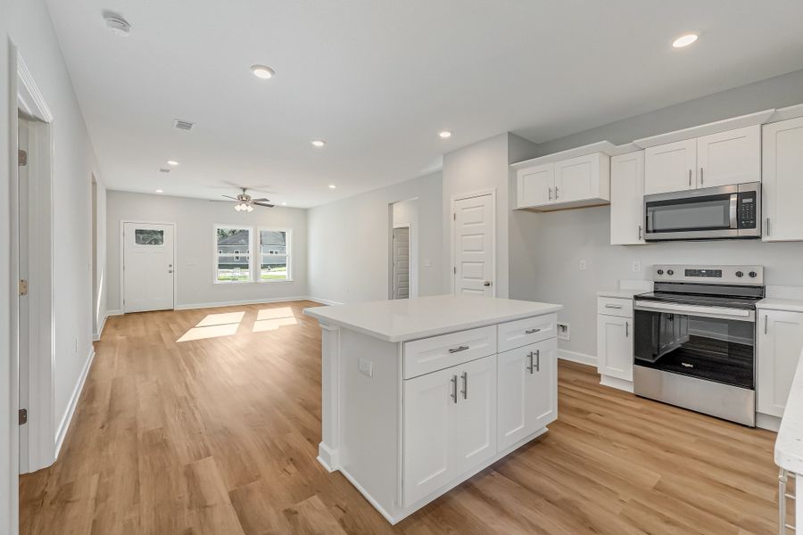 Furnished interior view inside a new home in Live Oak Cottages, Freeport (Image 8).