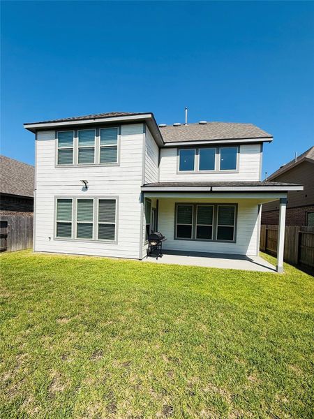 Front exterior of a new home in Mavera, Conroe, TX, highlighting curb appeal (Image 2).